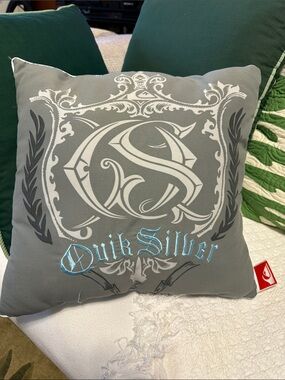 Collectible Quiksilver Gray Pillow of vintage 2000s surf culture merchandise.